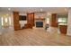 Inviting living room featuring custom built-ins, a stone fireplace, and a seamless flow to adjacent spaces at 306 Wild Olive Ln, Longwood, FL 32779
