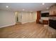 Expansive living space with custom built-in cabinets and stone fireplace at 306 Wild Olive Ln, Longwood, FL 32779