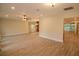 Open living room with tile floors, ceiling fan and a large window at 306 Wild Olive Ln, Longwood, FL 32779