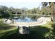 Scenic pond featuring an idyllic dock and lush surroundings for residents and accompanied guests at 306 Wild Olive Ln, Longwood, FL 32779
