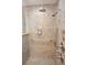Walk-in shower features updated fixtures and shower heads and a tile surround at 306 Wild Olive Ln, Longwood, FL 32779
