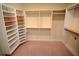 Walk-in closet featuring a built-in shelving system for optimal storage and organization at 306 Wild Olive Ln, Longwood, FL 32779