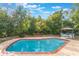 Inviting backyard pool, lush landscaping and poolside gazebo with seating for entertaining at 1098 Park Dr, Casselberry, FL 32707