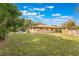 Expansive backyard with lush lawn, screened-in pool, and perimeter fencing at 1098 Park Dr, Casselberry, FL 32707