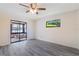 Bedroom featuring sliding doors and modern flooring at 1098 Park Dr, Casselberry, FL 32707