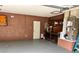 The garage features concrete walls and flooring, and lots of storage at 1098 Park Dr, Casselberry, FL 32707