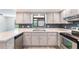 Updated kitchen featuring white cabinets, stainless steel appliances, and subway tile backsplash at 1098 Park Dr, Casselberry, FL 32707