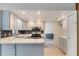 Stylish kitchen with white countertops, stainless steel appliances, and tile backsplash at 1098 Park Dr, Casselberry, FL 32707