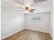 Bright bedroom with ceiling fan and wood-look floors at 1748 Haverhill Dr, Deltona, FL 32725