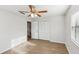 Bedroom with ceiling fan, wood floors, and built-in closet at 1748 Haverhill Dr, Deltona, FL 32725
