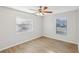 Spacious bedroom with ceiling fan and two windows at 1748 Haverhill Dr, Deltona, FL 32725