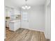Kitchen features white cabinets and a light-colored countertop at 1748 Haverhill Dr, Deltona, FL 32725