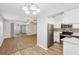 Modern kitchen featuring stainless steel appliances and white cabinets at 1748 Haverhill Dr, Deltona, FL 32725