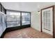 Sunlit screened porch featuring tile floors and window blinds at 1748 Haverhill Dr, Deltona, FL 32725