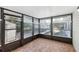 Bright screened porch with tile floor and window blinds at 1748 Haverhill Dr, Deltona, FL 32725