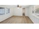 Sunroom with wood-look floors, ceiling fan and multiple windows at 1748 Haverhill Dr, Deltona, FL 32725