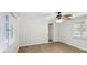 Sunroom with wood-look floors, ceiling fan and sliding glass doors at 1748 Haverhill Dr, Deltona, FL 32725