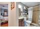 Bathroom with shower, vanity, and tiled walls at 405 Mallard Ln, Kissimmee, FL 34759