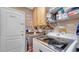Laundry room with washer, dryer, and storage cabinets at 405 Mallard Ln, Kissimmee, FL 34759