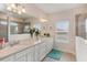 Elegant bathroom with double vanity and large mirror at 4150 Sunset Preserve Blvd, Orlando, FL 32820