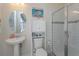 Small bathroom with shower and pedestal sink at 4150 Sunset Preserve Blvd, Orlando, FL 32820