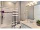 Clean bathroom with shower/tub combo and updated vanity at 4150 Sunset Preserve Blvd, Orlando, FL 32820
