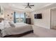 Main bedroom with a king-size bed and TV at 4150 Sunset Preserve Blvd, Orlando, FL 32820