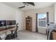 Bright bedroom with a workspace and built-in shelving at 4150 Sunset Preserve Blvd, Orlando, FL 32820