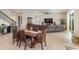Bright dining room featuring a wood table and six chairs at 4150 Sunset Preserve Blvd, Orlando, FL 32820