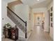 Elegant entryway with staircase and dark wood accents at 4150 Sunset Preserve Blvd, Orlando, FL 32820