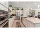 Modern kitchen with stainless steel appliances and white cabinets at 4150 Sunset Preserve Blvd, Orlando, FL 32820