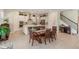 Open kitchen with white cabinets, island, and stainless steel appliances at 4150 Sunset Preserve Blvd, Orlando, FL 32820