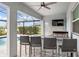 Outdoor kitchen with seating area and a view of the pool at 4150 Sunset Preserve Blvd, Orlando, FL 32820