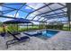 Relaxing pool and spa with a covered patio overlooking a pond at 4150 Sunset Preserve Blvd, Orlando, FL 32820