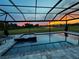 Enclosed patio with pool and sunset view at 4150 Sunset Preserve Blvd, Orlando, FL 32820