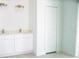 White bathroom with double vanity, and separate shower at 459 Cinnamon Dr, Kissimmee, FL 34759