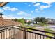 This balcony offers a panoramic view of the neighborhood with beautifully landscaped yards and tree-lined streets at 10852 Mobberley Cir, Orlando, FL 32832