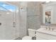 Stylish bathroom featuring a glass-enclosed shower, designer tile, and modern fixtures at 10852 Mobberley Cir, Orlando, FL 32832