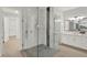 Bathroom showcasing a luxurious glass shower with a rain shower head and tile accent at 10852 Mobberley Cir, Orlando, FL 32832
