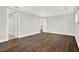Spacious bedroom with hardwood floors, recessed lighting, and views to the staircase and hallway at 10852 Mobberley Cir, Orlando, FL 32832