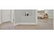 Elegant bedroom entrance showcases modern decor, neutral colors, and wood-look tile flooring at 10852 Mobberley Cir, Orlando, FL 32832