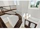 Grand foyer with dark wood stairs, a chandelier, and a view of the entrance at 10852 Mobberley Cir, Orlando, FL 32832