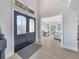 Grand foyer with decorative glass double doors and light hardwood floors creates an inviting entrance at 10852 Mobberley Cir, Orlando, FL 32832