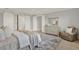 Serene main bedroom with a comfortable bed, soft lighting, and a well-appointed dresser at 10852 Mobberley Cir, Orlando, FL 32832