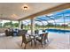 Covered patio featuring comfortable seating, an outdoor dining area, and a sparkling screened-in pool at 10852 Mobberley Cir, Orlando, FL 32832