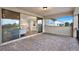 This covered patio features brick pavers and a beautiful view through sliding glass doors to the home's interior at 10852 Mobberley Cir, Orlando, FL 32832