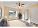 Bright bedroom with a large window, ceiling fan, and a view of the outdoors at 2053 Dixie Belle Dr # 2053C, Orlando, FL 32812