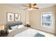 Stylish bedroom with a large window, a comfortable bed, and elegant decor at 2053 Dixie Belle Dr # 2053C, Orlando, FL 32812