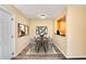 Cozy dining area featuring a modern table with six chairs and contemporary artwork on the walls at 2053 Dixie Belle Dr # 2053C, Orlando, FL 32812