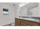 Bathroom showcasing dual sinks, granite countertops, and a shower-tub combination at 219 Ash Way, Auburndale, FL 33823